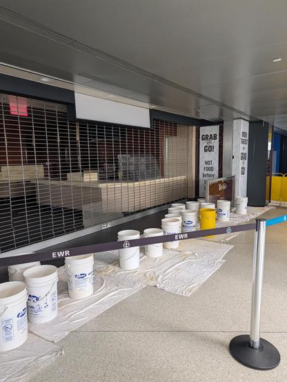 10 plus buckets catching leaky roof water