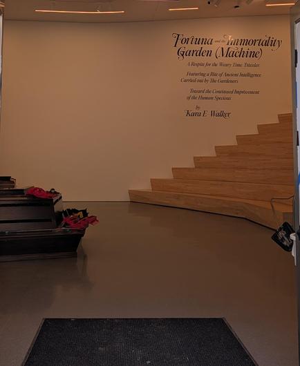 Title of a art piece on a wall: "Fortuna and the Immortality Garden (Machine)"